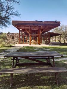 a picnic table in front of a building at Brisas de Chacras in San Javier