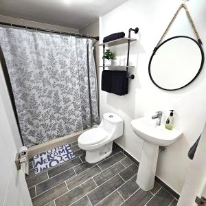 a bathroom with a toilet and a sink at Vane's House Consulado in Ciudad Juárez +48 photos