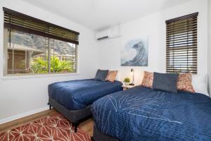 Ένα ή περισσότερα κρεβάτια σε δωμάτιο στο Hina & Honu Hideout +219 φωτογραφίες