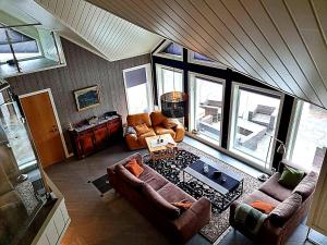 an overhead view of a living room with couches at Villa Heyerdahl Main House in Åmli
