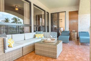 a living room with a couch and a table at New baths king bed open & tranquil pool hot tub in Waikoloa +108 photos