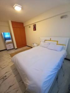 Postel nebo postele na pokoji v ubytování 1 bedroom apartment near UNECA