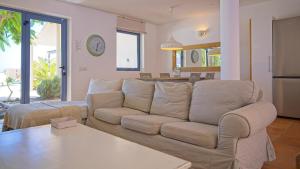a living room with a couch and a table at Villa MINEA II in Costa Calma +49 photos