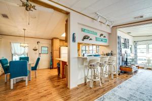a kitchen and living room with a table and chairs at Anglers Paradise! Homosassa River Retreat with Dock in Homosassa