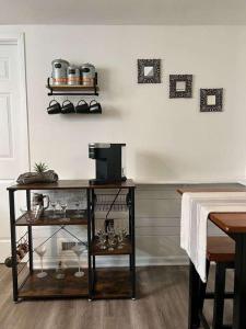 a room with a table with glasses on a wall at Modern & Renovated 3BR 1BA Home - Quiet & Cozy in Madison Heights