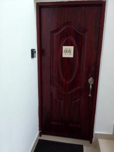 a wooden door with a sign that reads caffe at Villa del mar in Bayahibe +2 photos