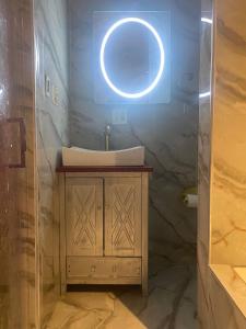a bathroom with a sink and a mirror at DC Private Room Luxury Spa Bath in Washington, D.C.