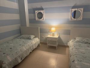 Una cama o camas en una habitación de Juan Dolio on the beach Beautiful beachfront apt