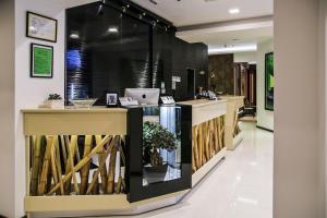 a lobby of a store with a counter at Garni Hotel Zen in Niš