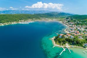 an aerial view of a small island in the water at Apartment Nedo in Supetarska Draga +27 photos