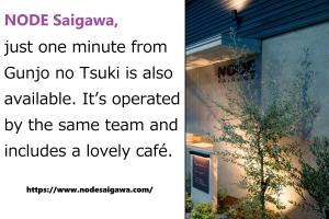 a post with a picture of a tree on the side of a building at Gunjo no Tsuki in Kanazawa