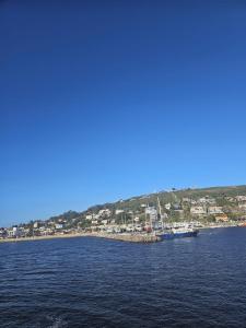 a boat in a body of water at Cabañas San Jorge in Bella Vista