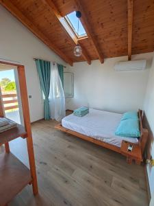 Кровать или кровати в номере Village Vila near the beach