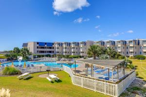 an image of a pool at a resort at Eclectic Atlantic Beach Condo with Amenity Access! in Atlantic Beach