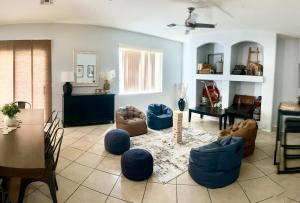 a living room with blue chairs and a table at Vail Vintage Vista in Vail