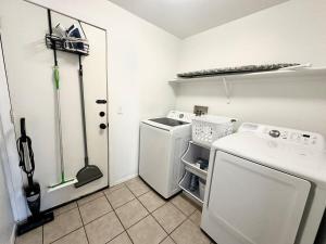 a laundry room with a washer and dryer in it at Vail Vintage Vista in Vail