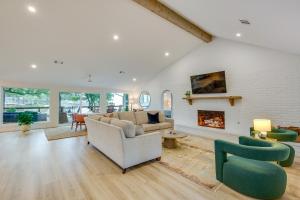 a living room with a couch and a fireplace at Private Dock Lakefront Enchanted Oaks Retreat in Enchanted Oaks