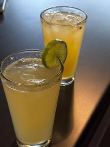 two drinks sitting on a table with a lime on top at Hotel Italia, Aguascalientes in Aguascalientes +39 photos