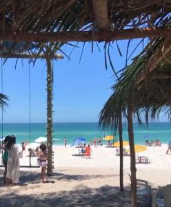 a group of people on the beach at Casa Sol & Mar in Arraial do Cabo