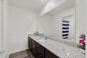 a bathroom with a sink and a mirror at Cute and cozy Homes in Buckeye in Buckeye +69 photos