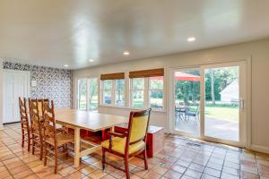 a dining room with a table and chairs at Riverfront Gem with Fire Pit in Eden in Eden +37 photos