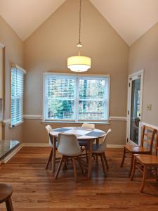 a dining room with a table and chairs at Knight play Golf court house in Apex