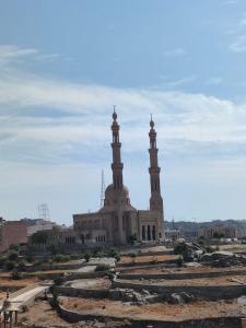 a large building with two towers on top of it at ABo ZAIN HOSTEL in Aswan