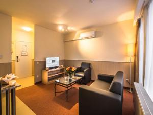 a living room with two couches and a table at Deluxe apartment with wifi in Antwerp in Antwerp