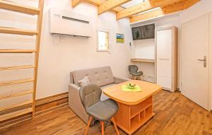 a small living room with a table and a chair at Ferienwohnung Malchow in Malchow