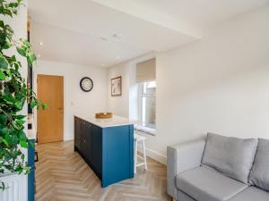 a living room with a couch and a table at Townhouse in Llandudno