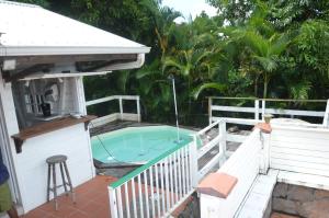 a hot tub on the deck of a house at Les Guettos 1&2. in Saint Esprit