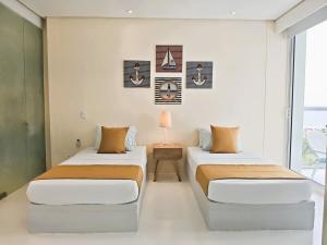 Postel nebo postele na pokoji v ubytování Morros 3 Apartamentos de Lujo + 18 fotografií