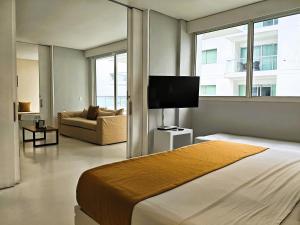 TV a/nebo společenská místnost v ubytování Morros 3 Apartamentos de Lujo