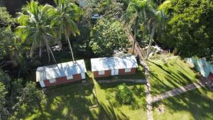 an aerial view of palm trees and a house at Hacienda Elean in Mayaguez