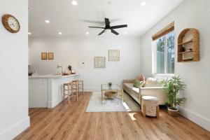 a living room with a couch and a ceiling fan at Luxury Oasis Compound with Hot Tub with 3 Homes in Escondido