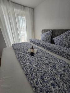 a bedroom with a bed with a laptop on it at Stilvolle Neubauwohnung mit Balkon&WLAN in Hannover +9 photos