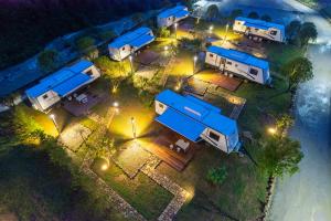 an overhead view of a group of rvs at night at Glamping Resort-At National Forest Park with Free Shuttle in Zhangjiajie +105 photos