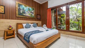 Postel nebo postele na pokoji v ubytování Uma Loris Ubud + 66 fotografií