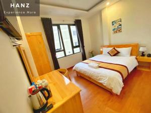 a bedroom with a bed and a desk and a window at S79 Hoa Dang Dalat in Da Lat +46 photos