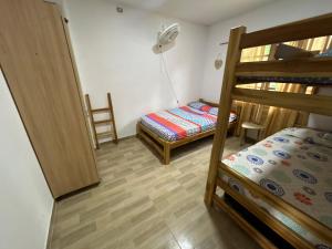 Giường trong phòng chung tại Villa Victoria Necoclí