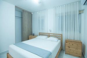 Giường trong phòng chung tại Your Ideal Refuge in Punta Cana +48 ảnh