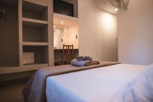 Кровать или кровати в номере Hotel Carlos Paz Centro - MONTECATINI