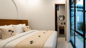 Ένα ή περισσότερα κρεβάτια σε δωμάτιο στο Arisitan Villa