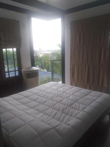 Katil atau katil-katil dalam bilik di Mervins & Indus Residence
