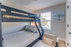 a bedroom with a bunk bed with a blue bunk bed at Front row Seat at 'The Sandy Rose' in Biloxi