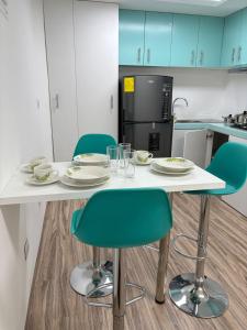 Η κουζίνα ή μικρή κουζίνα στο Jam's Suite Hogar y Confort +5 φωτογραφίες