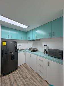 Η κουζίνα ή μικρή κουζίνα στο Jam's Suite Hogar y Confort