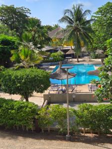 a view of the pool at the resort at Villa My Moon - en bord de mer au coeur de Saly in Saly Portudal