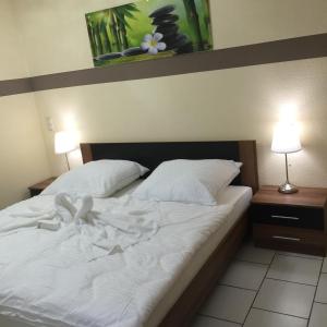 Postel nebo postele na pokoji v ubytování Boulevard Apartment