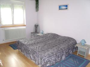 A bed or beds in a room at Viola Vendégház